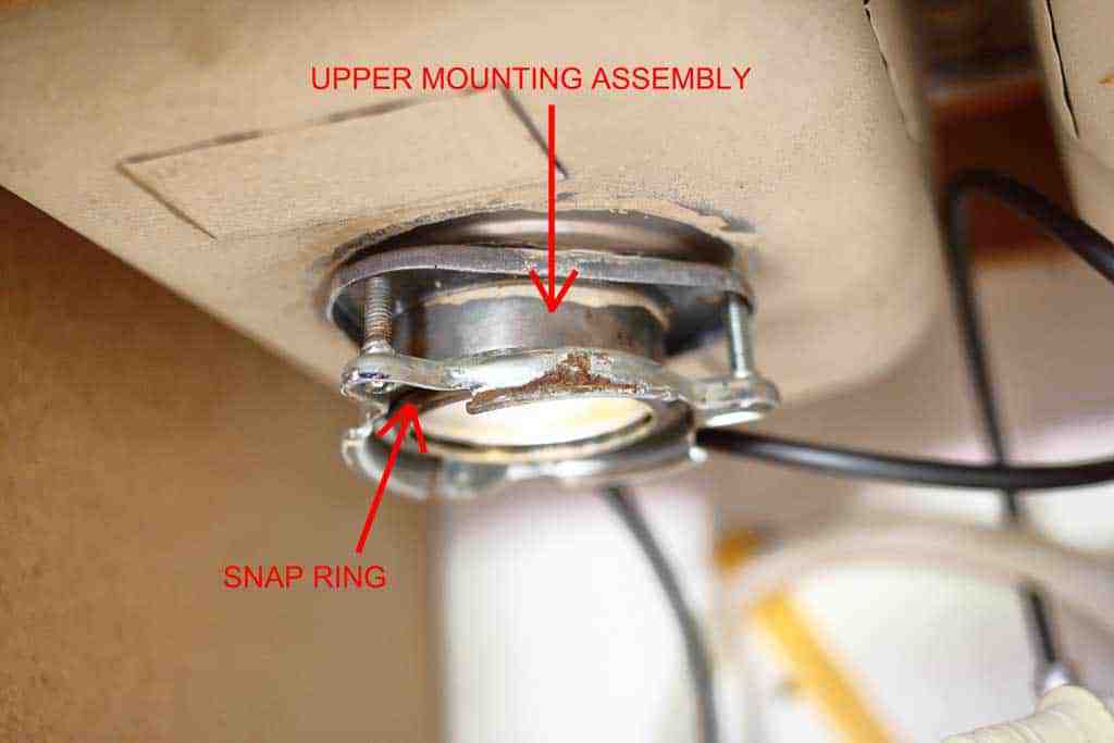 removing old upper mounting assembly for garbage disposal