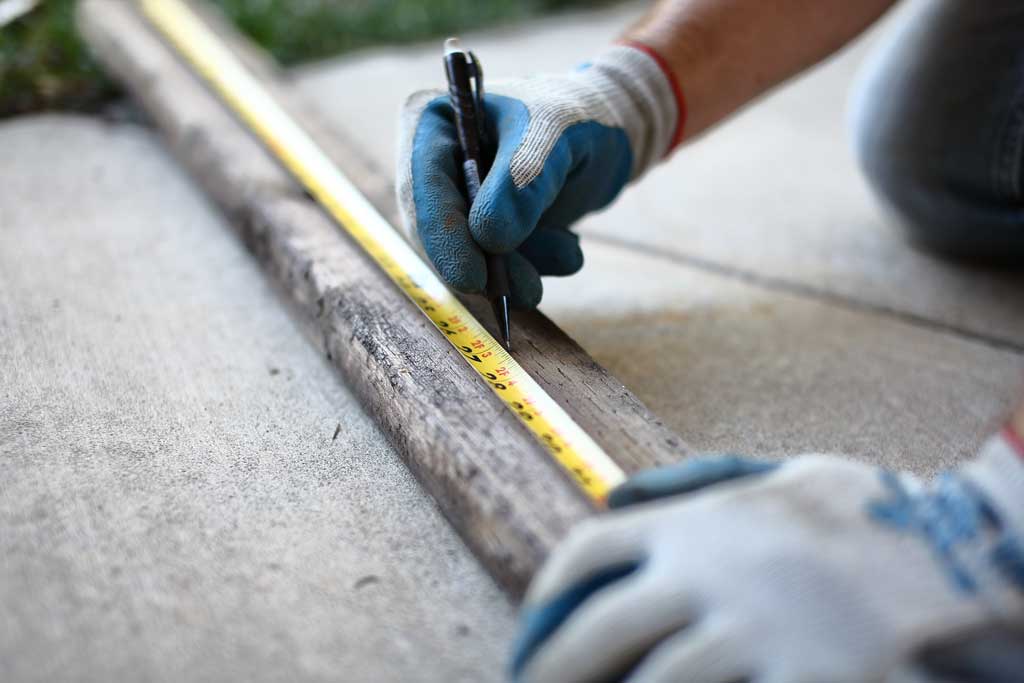 using a tape measure to cut wood