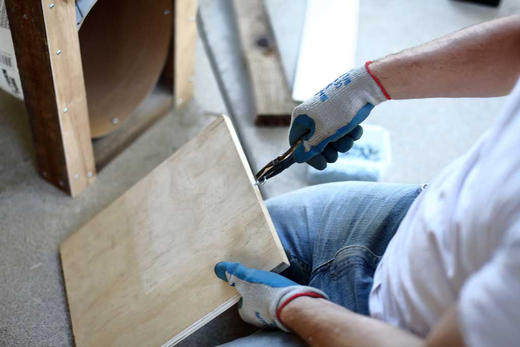 attaching screw eye on top of the door for the DIY skunk trap