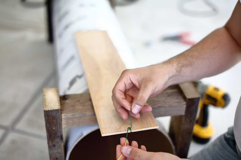 tying the string of the floor piece