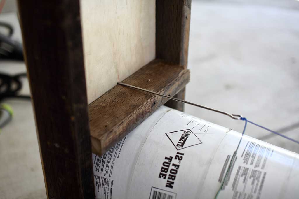 inserting the pin into the front door of the