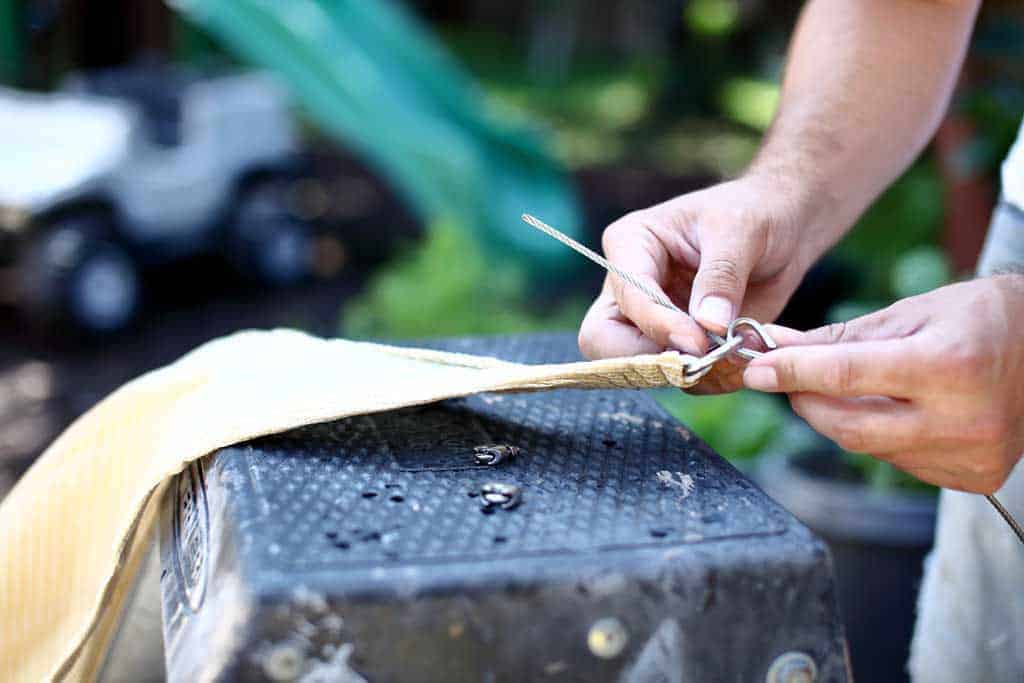 feeding cable thru the D-ring on fabric sunshade