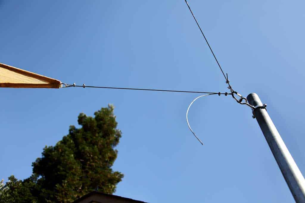 cable attached to post and fabric sunshade