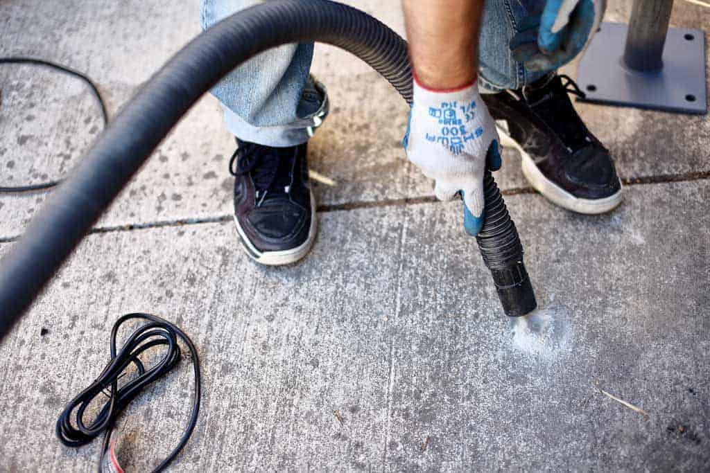 vacuuming duct from drilled hole