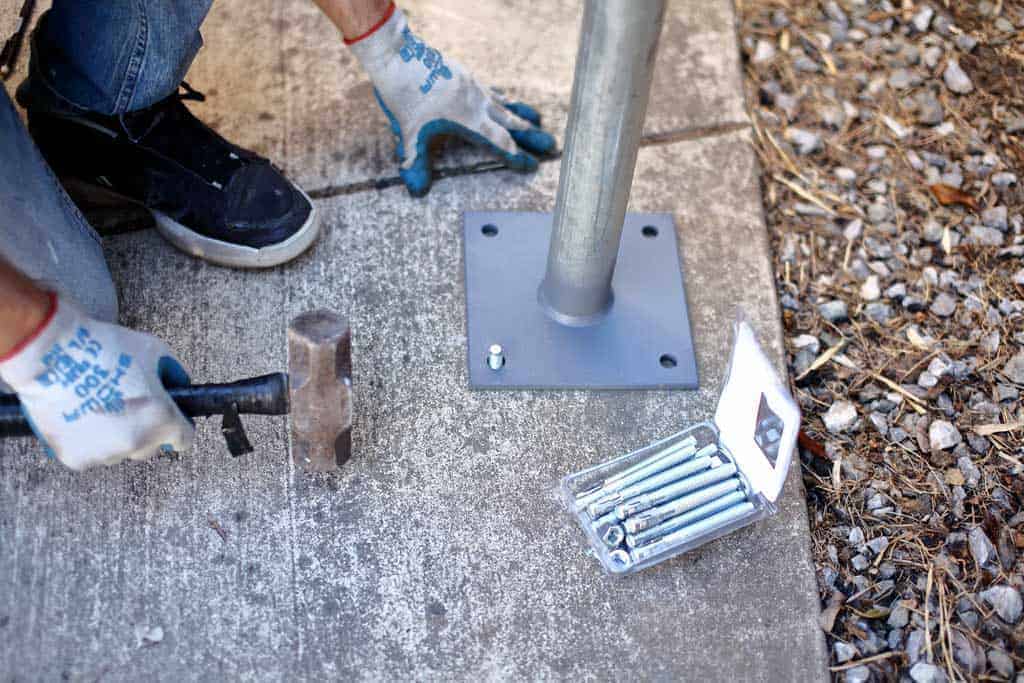 hammering anchor into the concrete