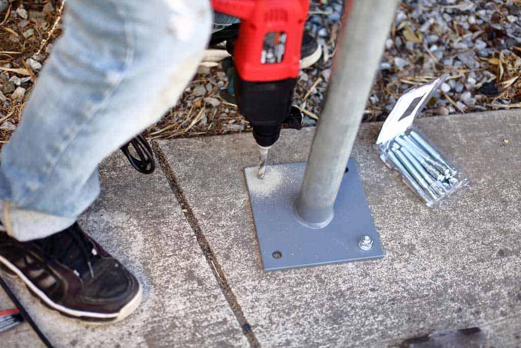 drilling concrete to insert anchors