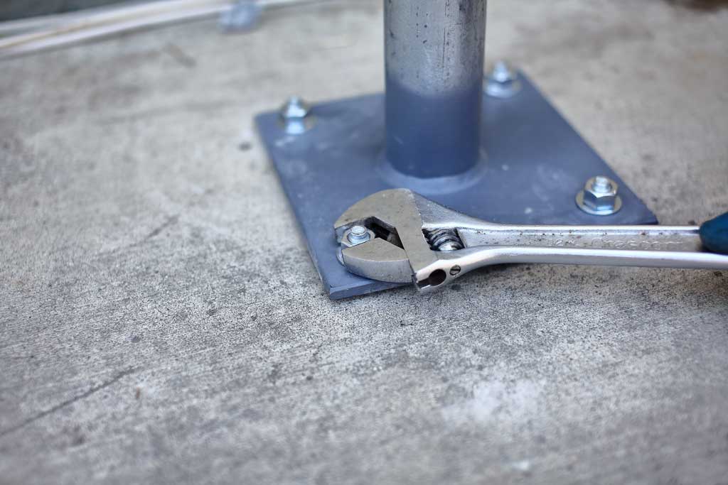 tightening the nuts on anchors for concrete