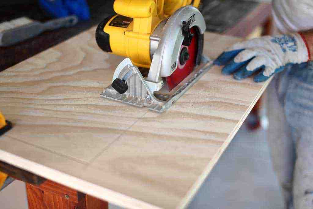using skill saw to cut opening in the cabinet