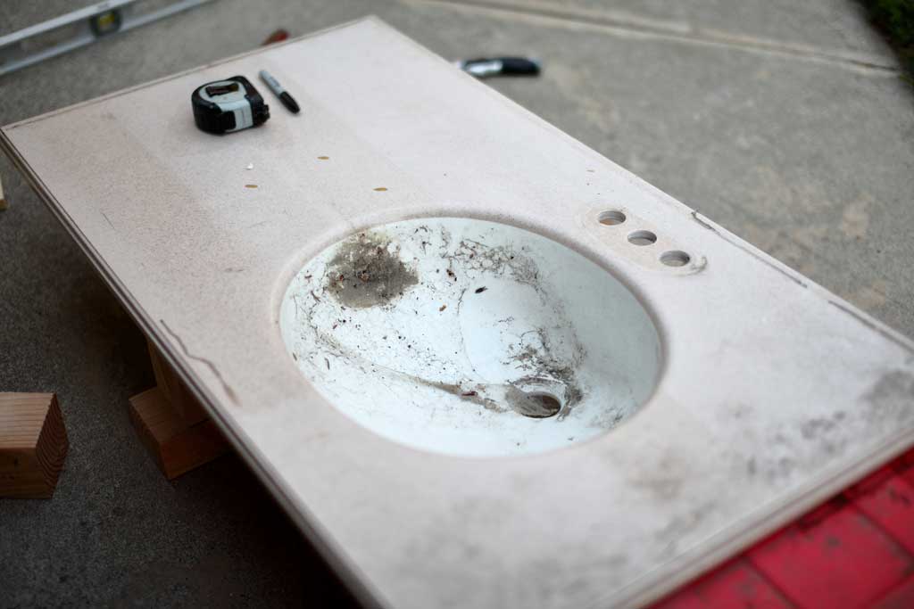 old vanity top for diy backroom cabinet