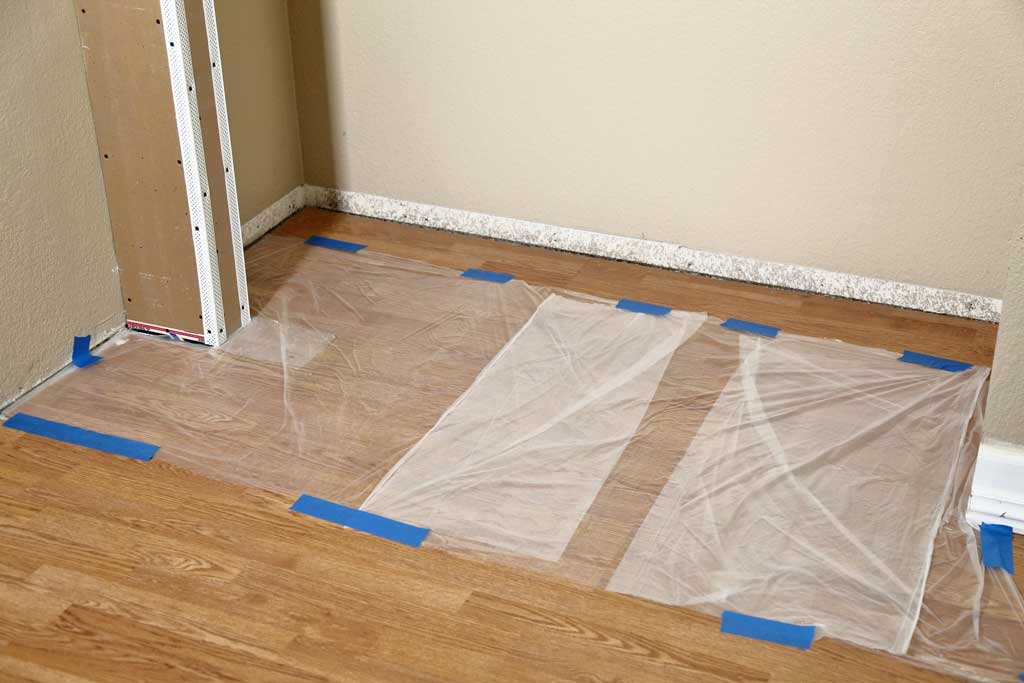 covering floor with plastic sheeting