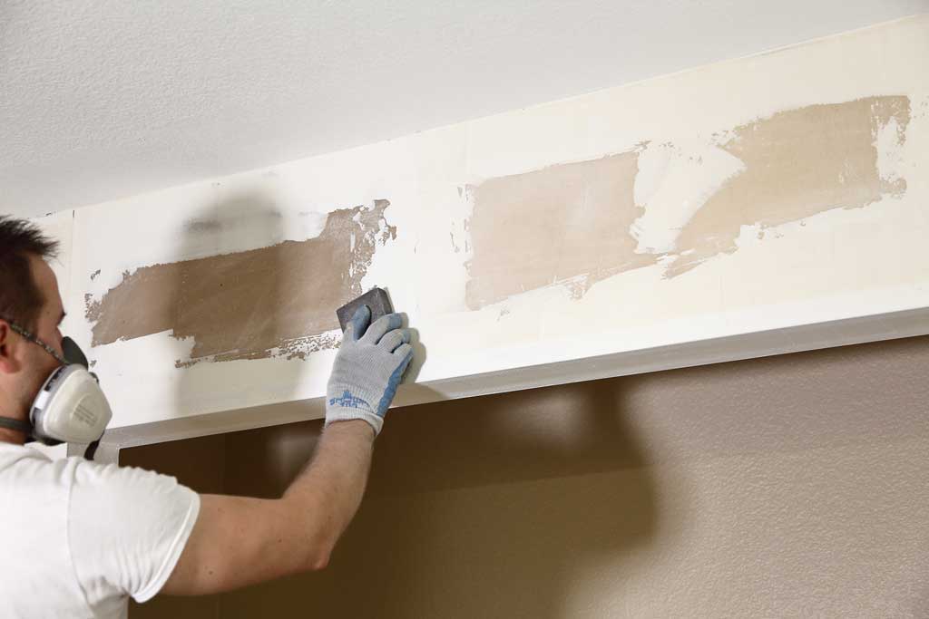 sanding drywall mud from wall