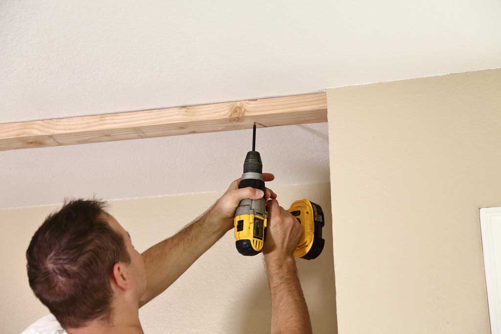 attaching top track to ceiling