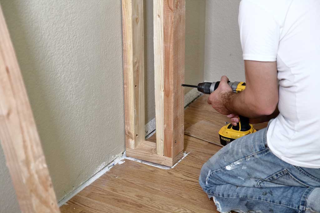 attaching trimmer stud to a wall of a diy closet