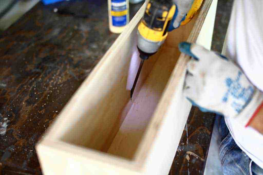 attaching back piece of the diy flower planter box