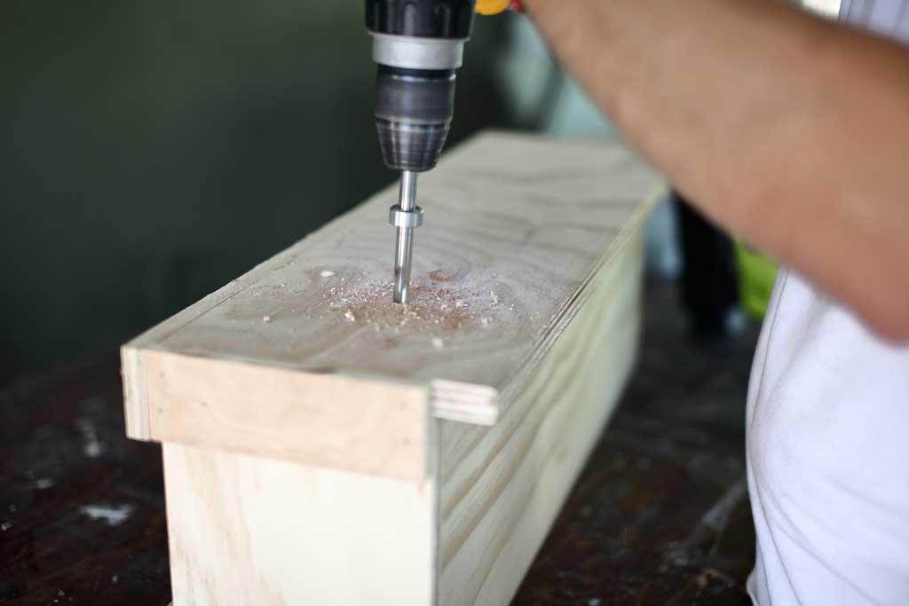 drilling hole for water drainage of the diy flower planter box