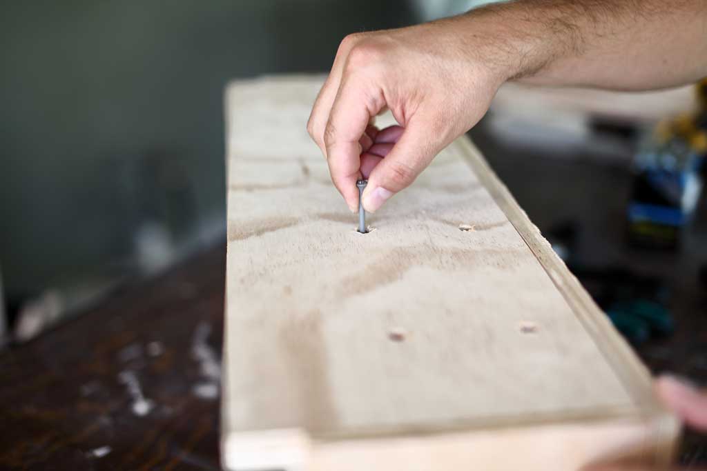 poking hole thru the bottom of the diy flower planter box