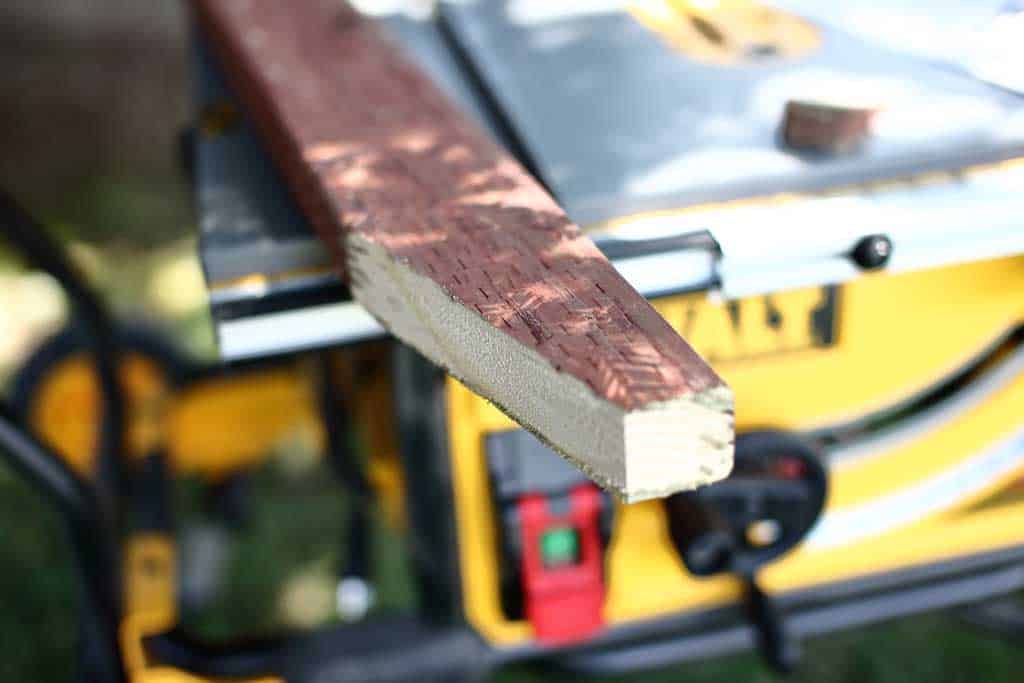 cutting 2x4 are 16 degrees for DIY pyramid gutter planter