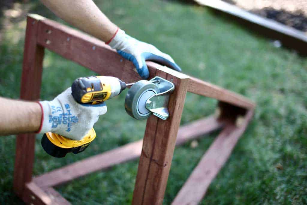 attaching wheels for the DIY pyramid gutter planter