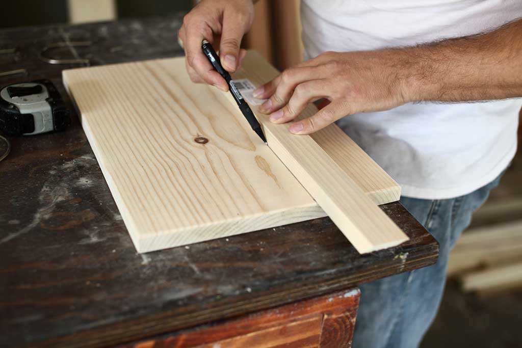 drawing a line for strap locations of the diy jar organizer