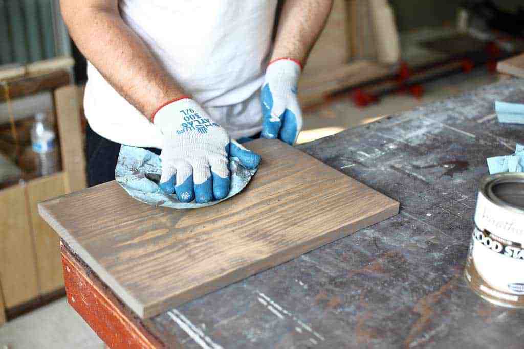 wiping off stain from a board