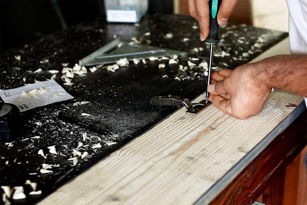 attaching door hinges for DIY Farmhouse Media Console with TV Lift