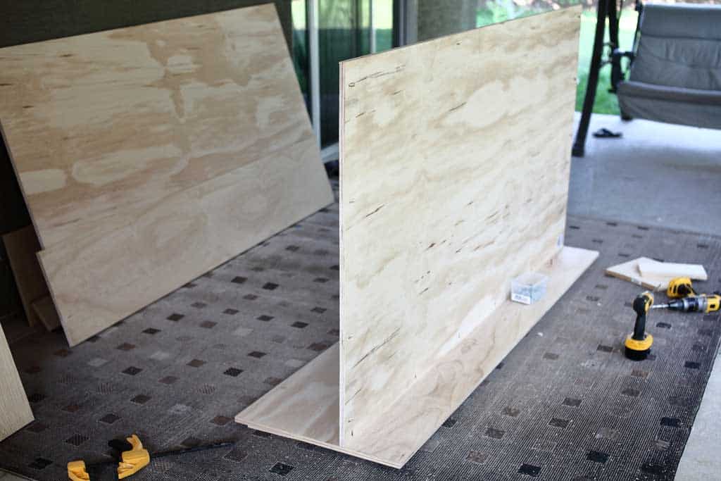 attaching backboard to bottom board of the media center