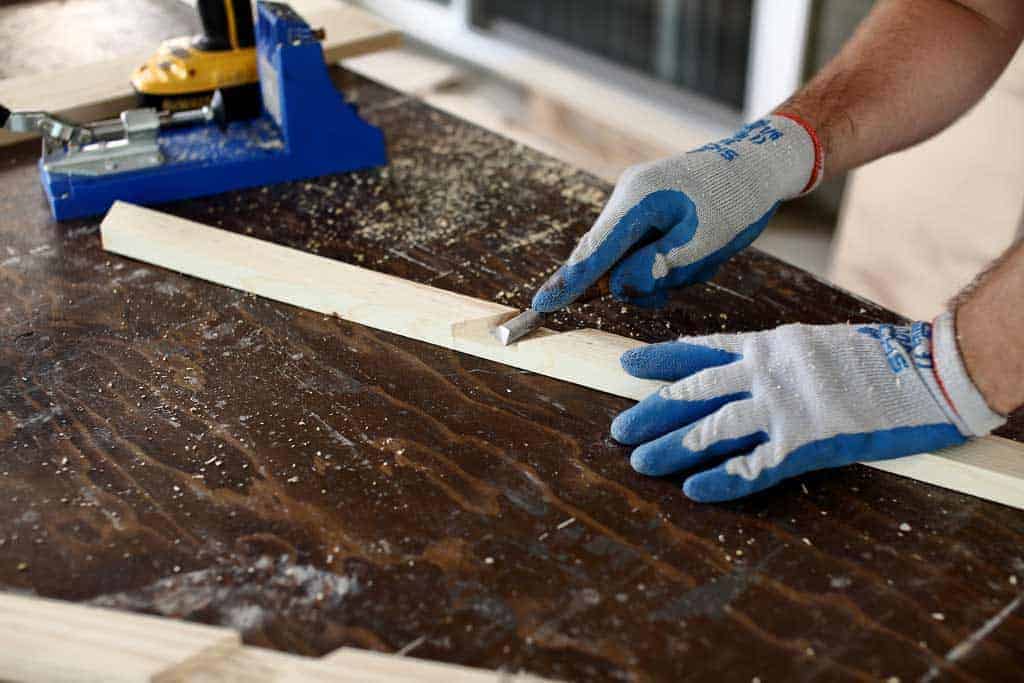 using wood chisel to remove dirt