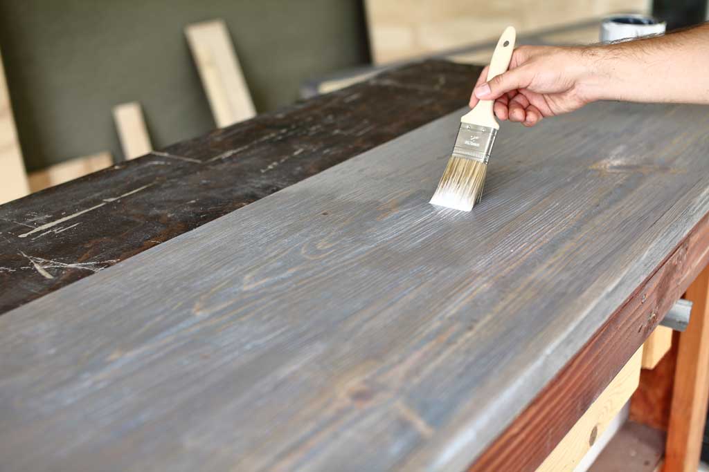 applying polyurethane to DIY Farmhouse Media Console with TV Lift
