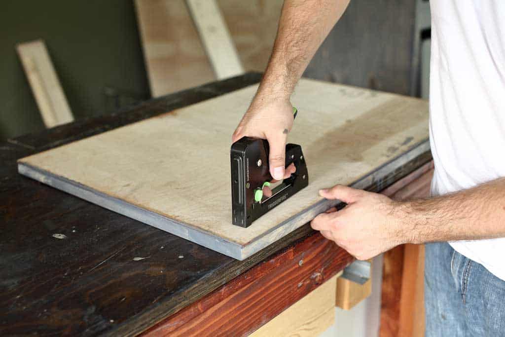stapling plywood to barn door