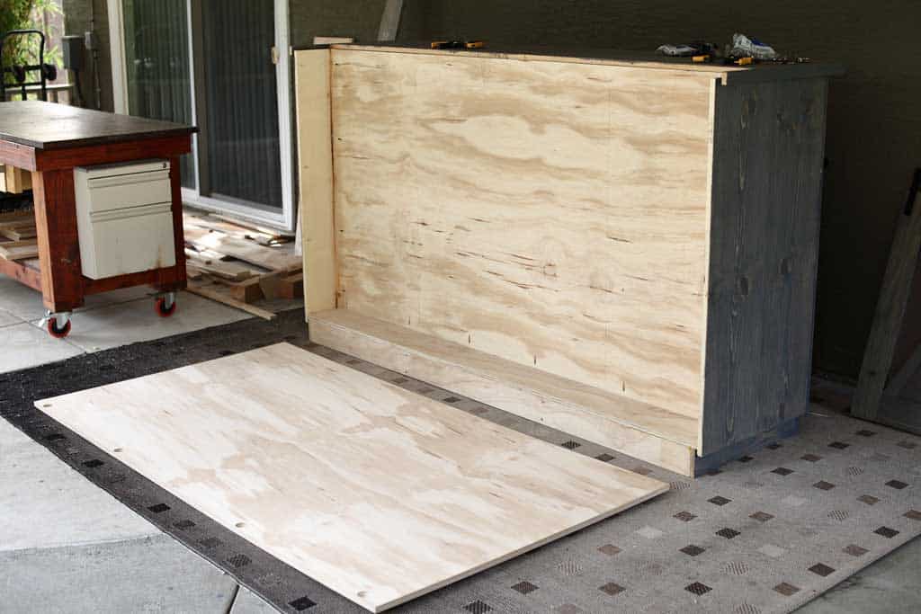 attaching backboard to the DIY Farmhouse Media Console with TV Lift