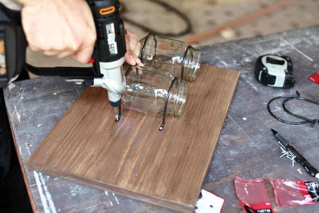 attaching straps to hold the jars