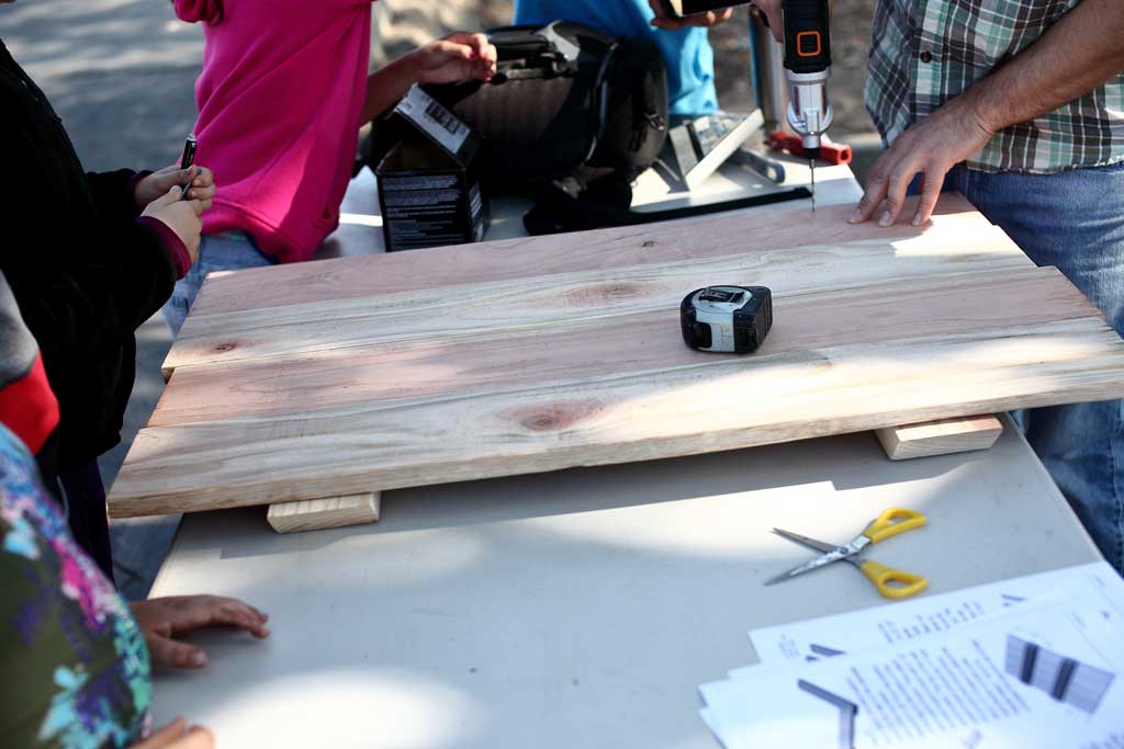 attaching the bottom boards for the sand box