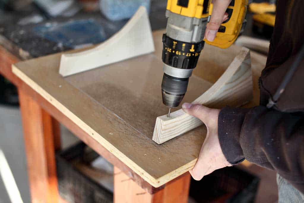 drilling pilot holes in wood for the DIY bird feeder house