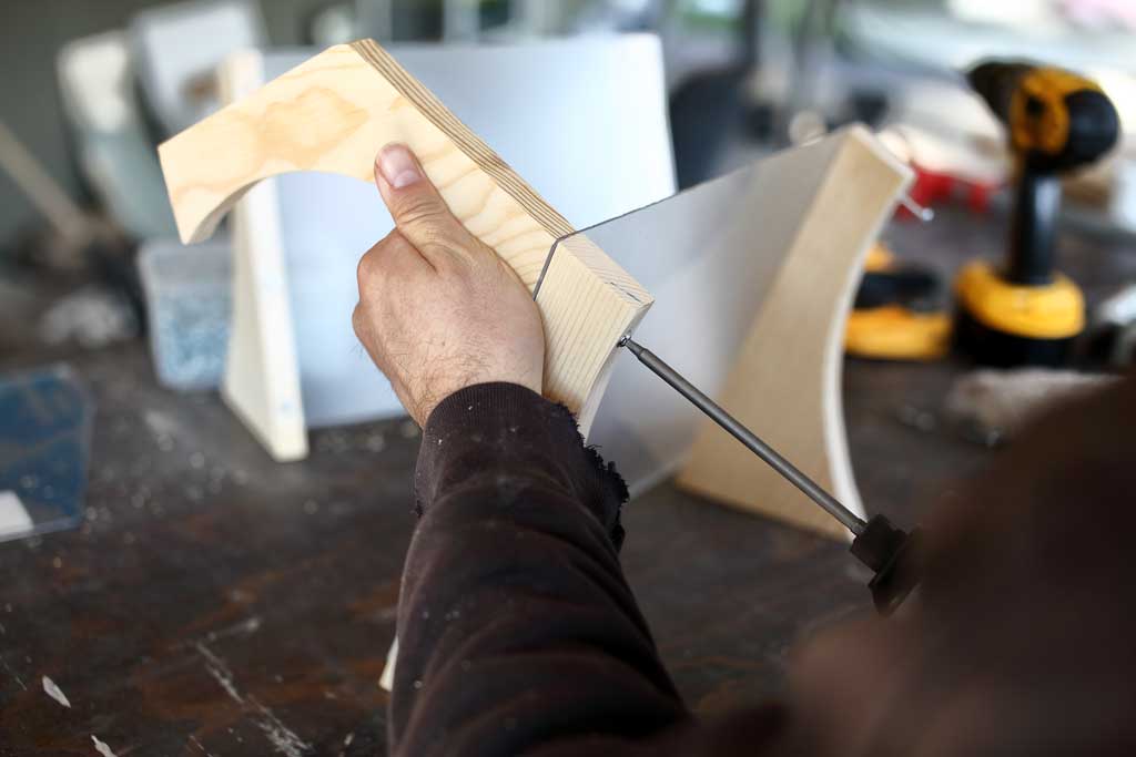 attaching aches to the legs of the DIY bird feeder house