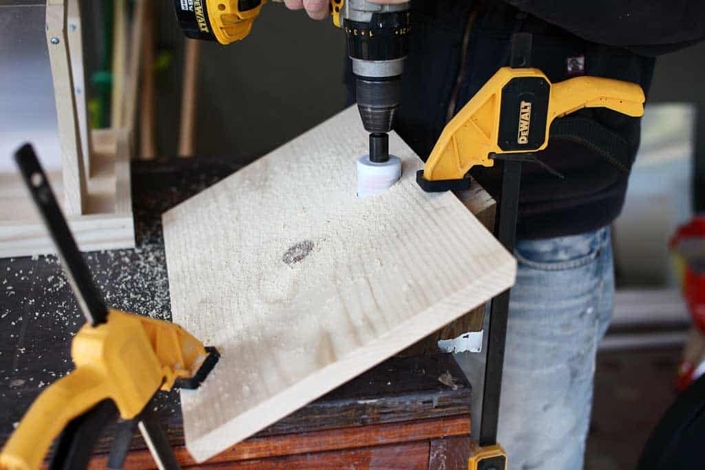 drilling a hole for chimney of the DIY bird feeder house