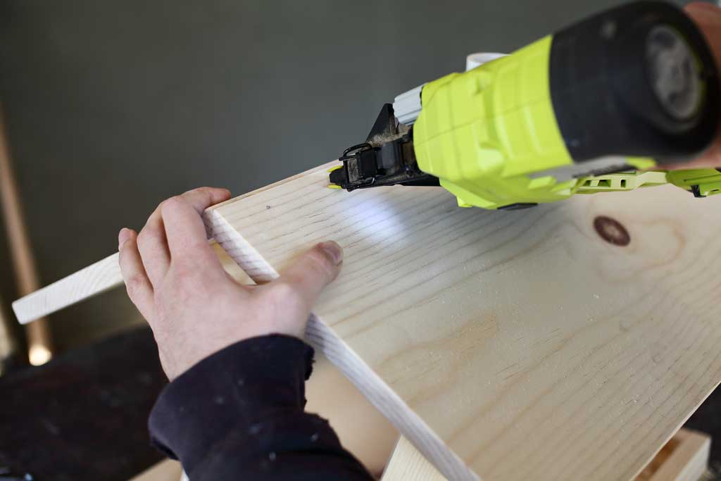 using nail gun to attach roof boards together