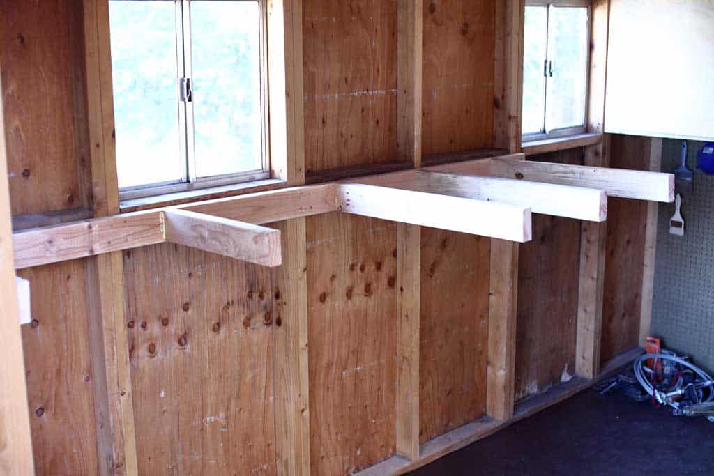attaching shelf support to wall in a shed