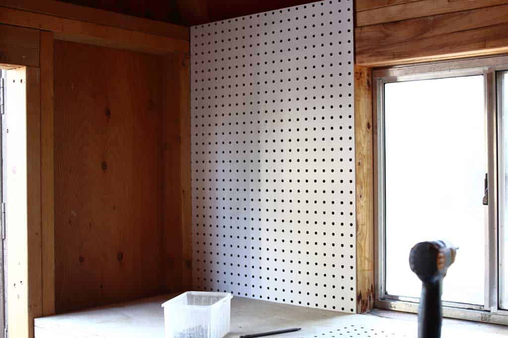 attaching pegboard to the wall