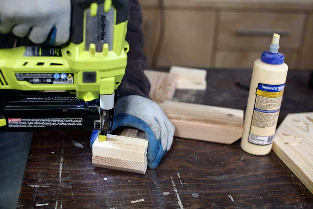 using nail gun to attach base of end table