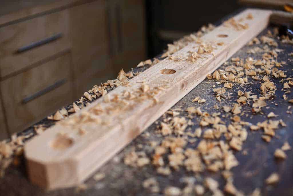 drilling holes for the ladder toss game