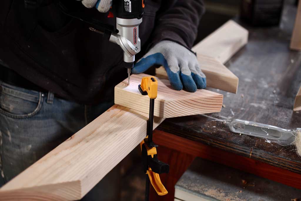 pre-drilling a pilot hole in 2x4