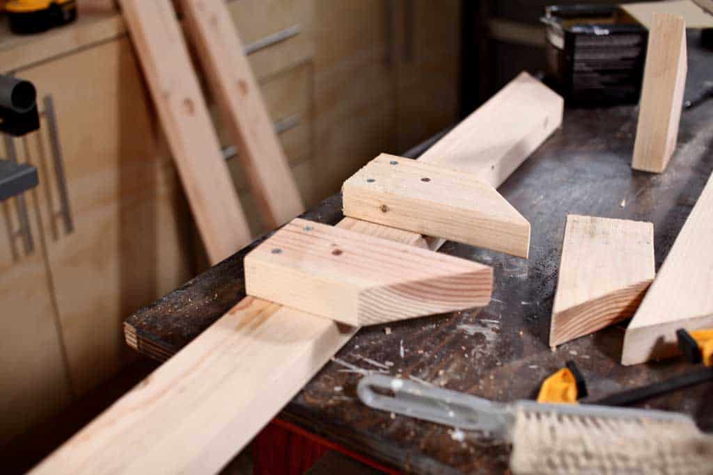 assembling the base of the DIY wooden ladder toss game