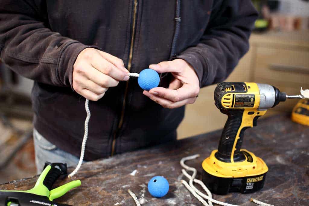 attaching rope to the golf ball
