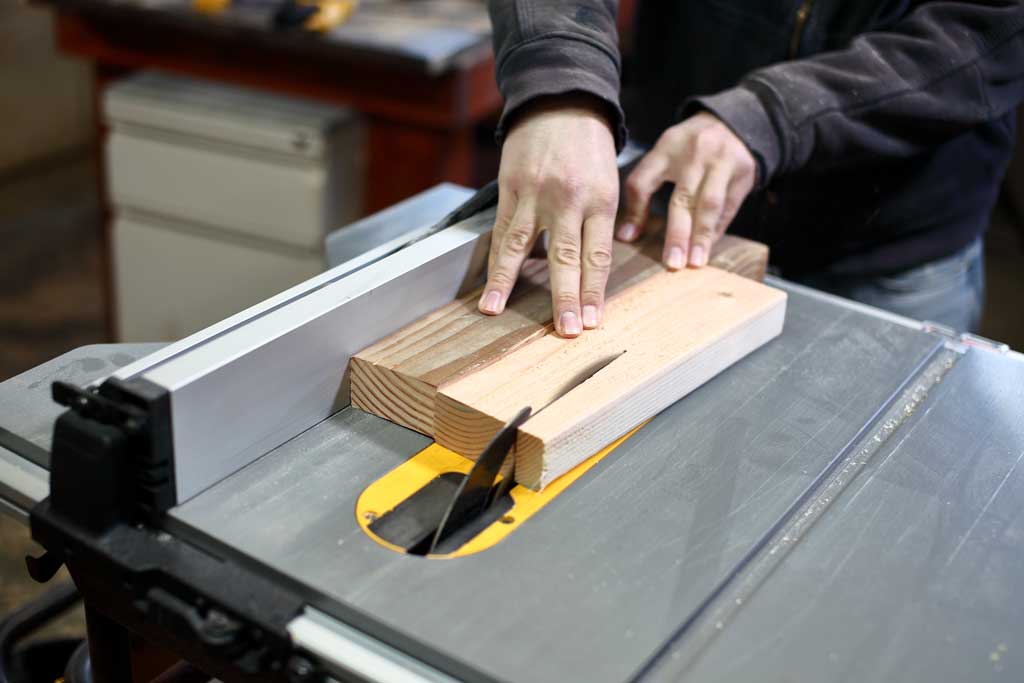 cutting legs using a jig on the table saw