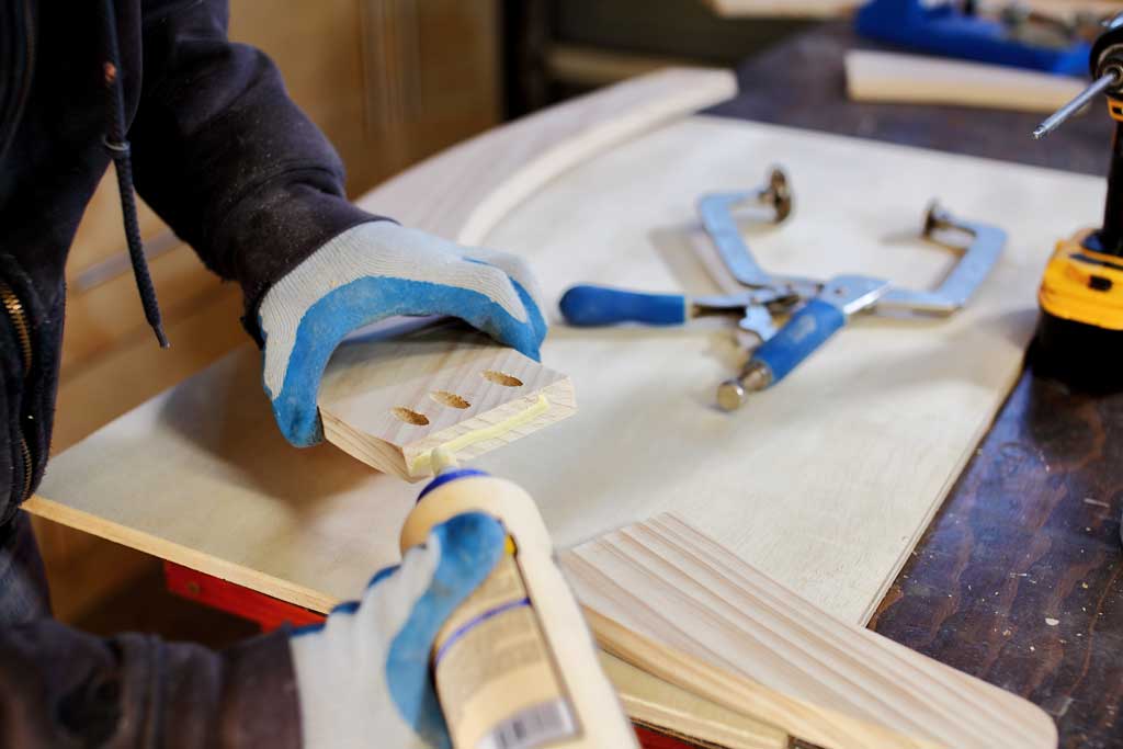 applying wood glue to rocker boards