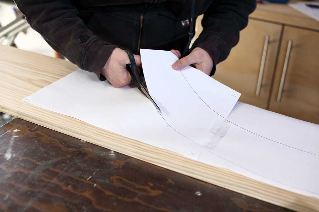 cutting out template with scissors