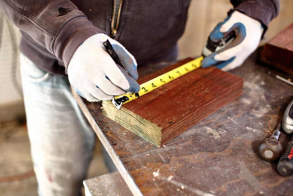 pulling a measurement with measuring tape