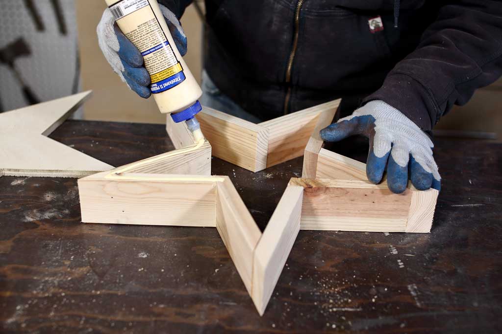 applying wood glue on wood