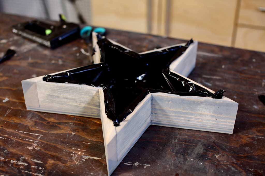 attaching plastic sheeting inside planter