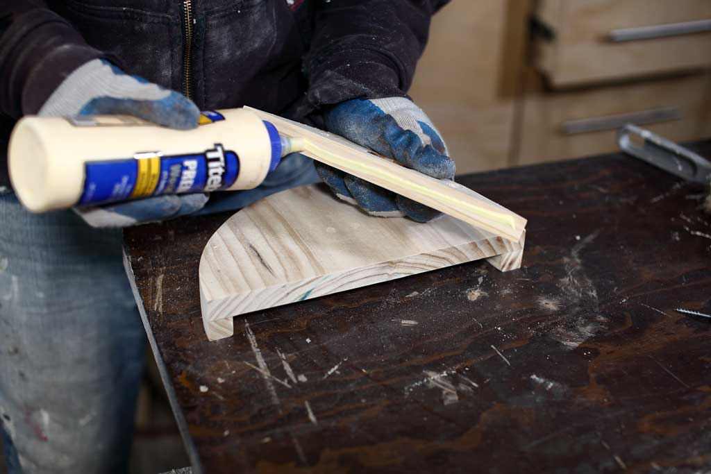 applying wood glue on wood